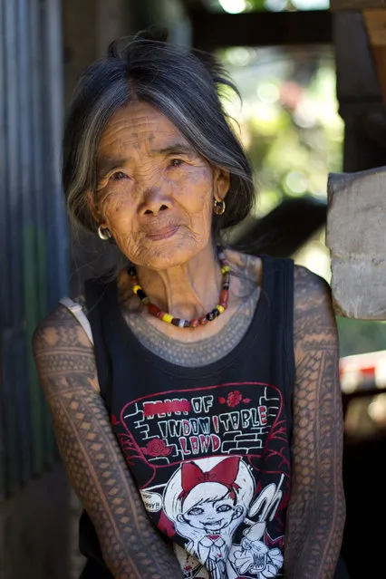 “The Last Kalinga Tattoo Artist”. A fascinating culture of the Igorot people brought me and my girlfriend to Kalinga. Head-hunting ceased decades ago, however, the motifs of Kalinga tattoos and the way they are being tattoed remains the same (charcoal and an orange thorn). We decided to visit this beautiful tribeswoman who is the last Kalinga tattoo artist. After a few days, long hours spent on buses and jeepneys, we were lucky to find a local guide Francis who brought us to Buscalan. We were overwhelmed how hospitable and friendly she is. Her natural beauty and her tattoo tempted me to ask her for a pose outside her dwelling. Location: Buscalan village, Kalinga, North Luzon, Philippines. (Photo and caption by Michal Duchek/National Geographic Traveler Photo Contest)