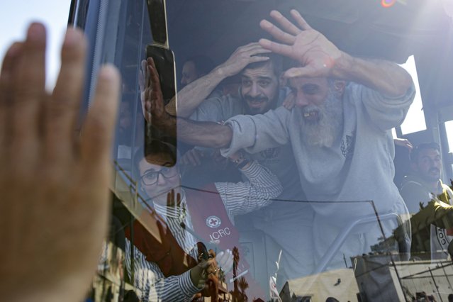 Freed Palestinian prisoners wave from a bus as they arrive in the Gaza Strip after being released from an Israeli prison following a ceasefire agreement between Hamas and Israel in Khan Younis, Saturday, February 1, 2025. (Photo by Jehad Alshrafi/AP Photo)