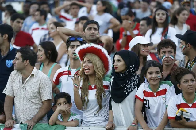 Iran fans react after conceding a goal during their Asian Cup quarter-final soccer match against Iraq at the Canberra stadium in Canberra January 23, 2015. (Photo by Tim Wimborne/Reuters)