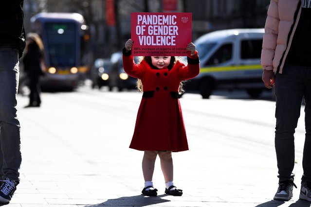 Ariana Lamcellari, 4, holds a sign at a protest against violence, following the charge of a British police officer in the London kidnapping and murder of Sarah Everard, in Dublin, Ireland on March 16, 2021. (Photo by Clodagh Kilcoyne/Reuters)