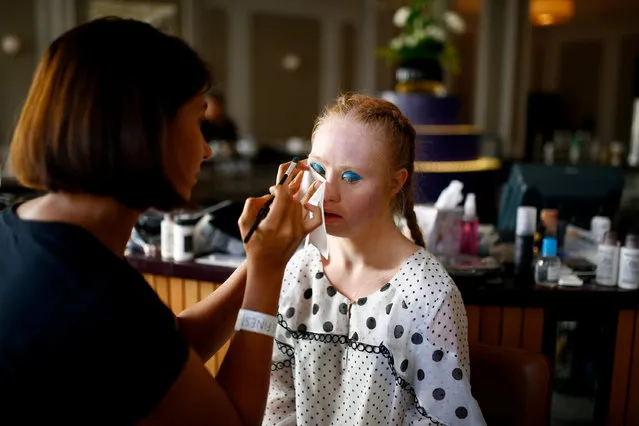 Model Madeline Stuart, who has Down's syndrome, prepares backstage of the Soiree show at London Fashion Week Women's in London, Britain, September 16, 2018. (Photo by Henry Nicholls/Reuters)
