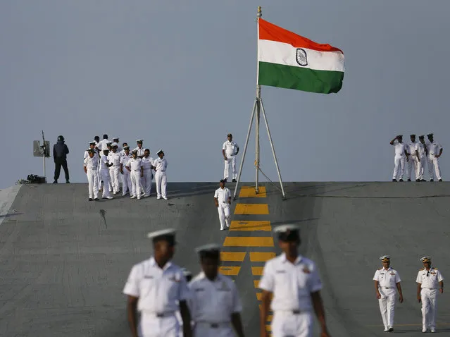 Sri Lankan military officers walk on Indian Navy's largest aircraft carrier INS Vikramaditya at Colombo port in Sri Lanka January 21, 2016. (Photo by Dinuka Liyanawatte/Reuters)