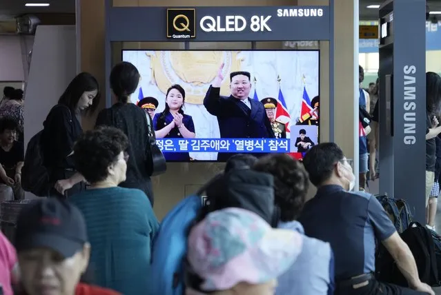 A TV screen shows an image of North Korean leader Kim Jong Un and his daughter, left, attending a paramilitary parade ceremony marking North Korea's 75th founding anniversary in Pyongyang, North Korea, during a news program at the Seoul Railway Station in Seoul, South Korea, Saturday, September 9, 2023. (Photo by Ahn Young-joon/AP Photo)