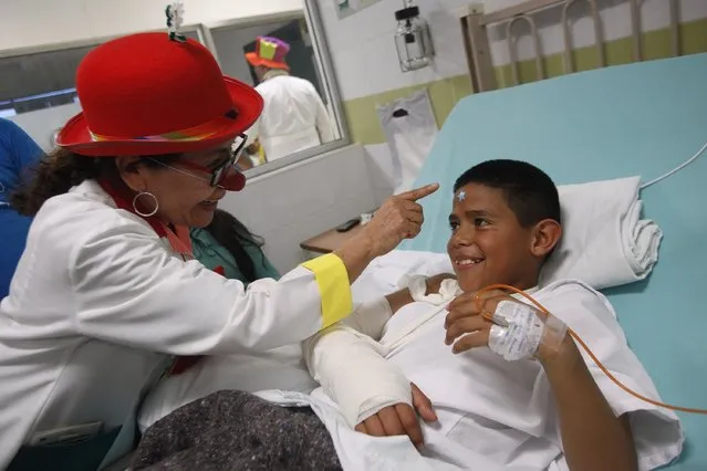 A member of “Laughter Doctors of Ciudad Juarez” performs at a children's hospital in Ciudad Juarez March 11, 2015. (Photo by Jose Luis Gonzalez/Reuters)