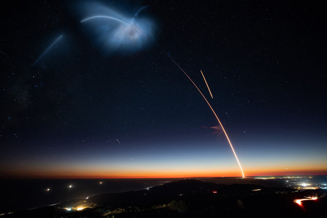 A SpaceX Falcon 9 rocket lights up the evening sky over Oceanside, California as it carries an Argentinian Earth-observing satellite into space after blasting off from Vandenberg Air Force Base, California, U.S., October 7, 2018. (Photo by UPI/Barcroft Images)