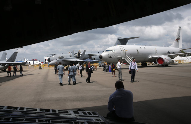 U.S. Air Force Boeing P-8 Poseidon (R) is displayed at the Singapore Airshow at Changi Exhibition Center February 18, 2016. (Photo by Edgar Su/Reuters)