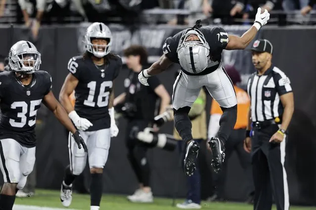 Las Vegas Raiders wide receiver Tre Tucker (11) celebrates after scoring a touchdown against the Los Angeles Chargers during the first half of an NFL football game, Thursday, December 14, 2023, in Las Vegas. (Photo by Steve Marcus/AP Photo)