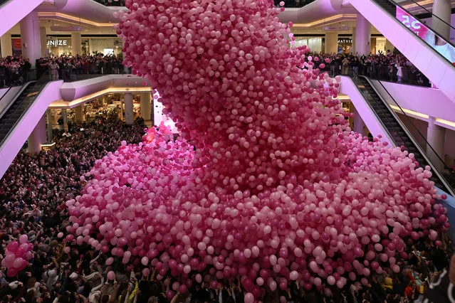 A shopping center drops more than 55 thousand balloons on its visitors within Valentine's Day celebrations in Moscow, Russia on February 14, 2024. (Photo by Sefa Karacan/Anadolu via Getty Images)