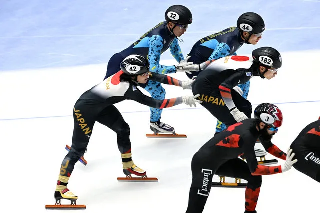 Skaters from Canada, Kazakhstan and Japan compete in the men's 5000m Relay Finals at the ISU World Cup Short Track Speed Skating in Gdansk on February 18, 2024. (Photo by Sergei Gapon/AFP Photo)