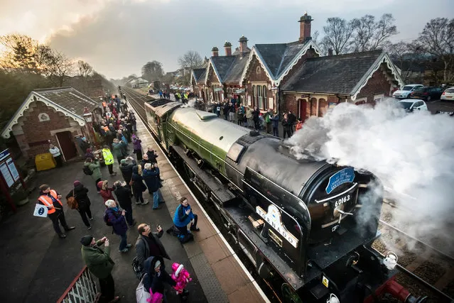 The Tornado locomotive at Appleby station before it pulls the first timetabled main line steam-hauled service for half a century across the Ribblehead viaduct in North Yorkshire on February 14, 2017 in Appleby, England. It is the first time in decades that a steam locomotive has been used for timetabled services on the world famous Carlisle to Settle line. The services are part of celebrations to mark the reopening of the line after landslides closed a long stretch. (Photo by Danny Lawson/PA Wire)