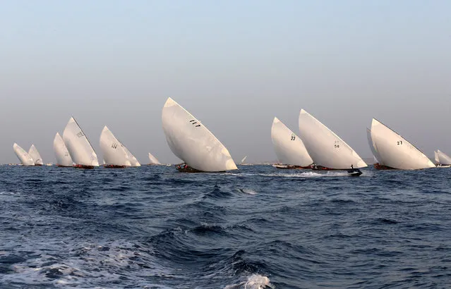 Teams compete in the 29th annual dhow sailing race, known as The Gaffal, near Sir Bu Nuayr Island, UAE on May 3, 2019. (Photo by Satish Kumar/Reuters)