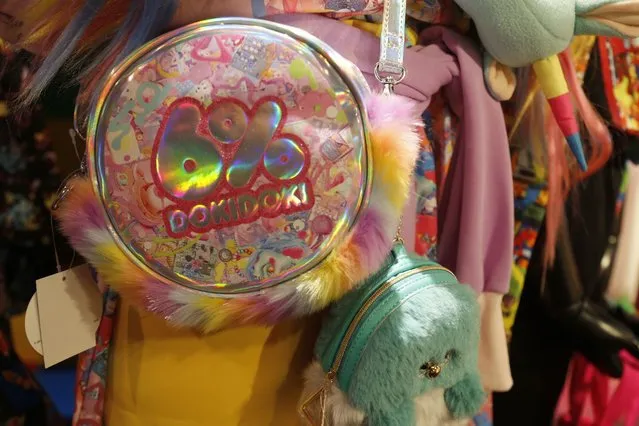 A bag on sale hangs at “6%DOKIDOKI” store along with other “kawaii”, or cute products, such as clothing and other knickknacks, in Tokyo's Harajuku district Friday, October 22, 2021. (Photo by Yuri Kageyama/AP Photo)