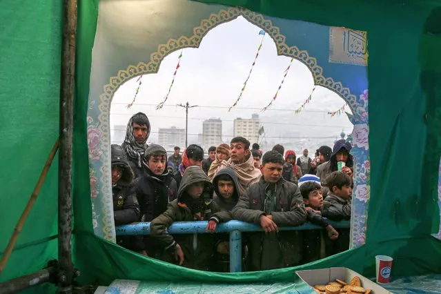 Afghan Shi'ite Muslims visit Sakhi Shah-e Mardan Shrine as they mark the birth of Imam Mahdi during the Kart-e-Sakhi pilgrimage in Kabul, Afghanistan, 26 February 2024. Afghan Shiites in Kabul and across the country celebrated the birth of Imam Mahdi (A.S.) during the Karte Sakhi pilgrimage, marking the 15th of Sha'ban with special programs and ceremonies. The event, held in mosques and takayas, featured chanting, hymns, receptions, and discussions on Mahdism. (Photo by Samiullah Popal/EPA/EFE)