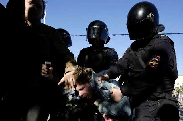 Police officers detain a participant during a rally held by LGBT activists and their supporters on the International Day Against Homophobia, Transphobia and Biphobia in central Saint Petersburg, Russia on May 17, 2019. (Photo by Anton Vaganov/Reuters)