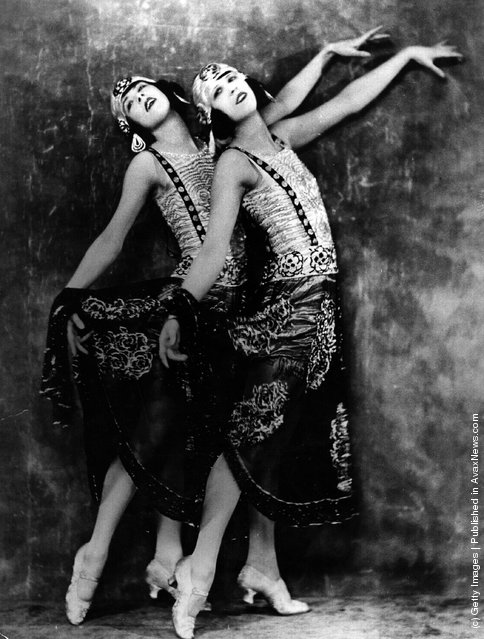 Two young women who perform in a cabaret at the Piccadilly Hotel strike a pose