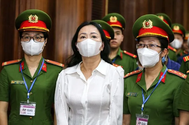 Vietnam's property tycoon Truong My Lan (C) arrives at a court in Ho Chi Minh city on March 5, 2024. A top Vietnamese property tycoon went on trial on March 5, 2024 along with dozens of others, accused of embezzling $12.5 billion in the country's biggest ever fraud case. (Photo by AFP Photo)