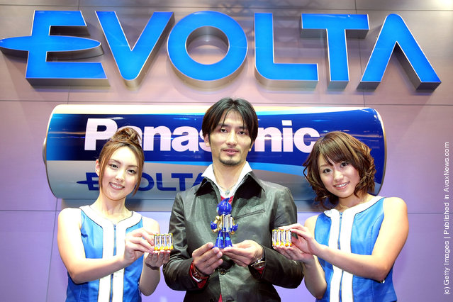 Creator of the 'EVOLTA' robot, Tomotaka Takahashi (C) introduces Panasonic's new alkaline battery EVOLTA series at Tokyo Midtown on January 15, 2008 in Tokyo, Japan. The new AA alkaline battery sets a Guinness World Record for the longest service life