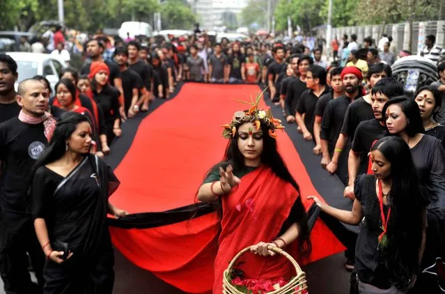 Participants, headed by the group Pracha Nat, commemorated the event by performing a program called 'Journey to the Red' Black night of 25 March 1971 anniversary, Dhaka, Bangladesh – 25 Mar 2014 On the 25 th March 1971, the Pakistani military launched Operation Searchlight, killing thousands. The Pakistan army attacked the halls at Dhaka University killing the several thousand unarmed Bengalis. The operation was ordered by the central government of West Pakistan. (Photo by Zakir Hossain Chowdhury/Rex Features)