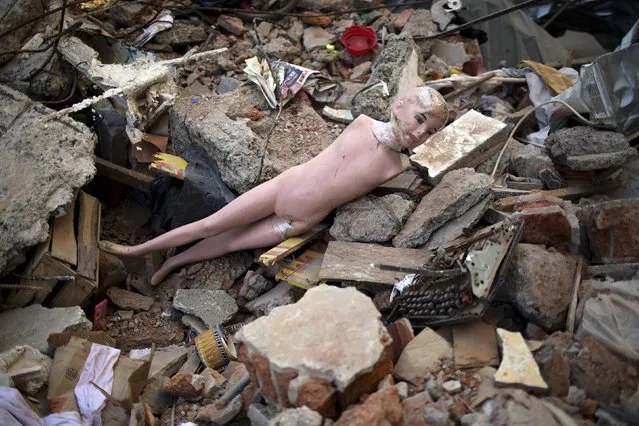 A mannequin lies amid the rubble caused by a 7.8-magnitude earthquake, in La Chorrera, Ecuador, Monday, April 18, 2016. (Photo by Rodrigo Abd/AP Photo)