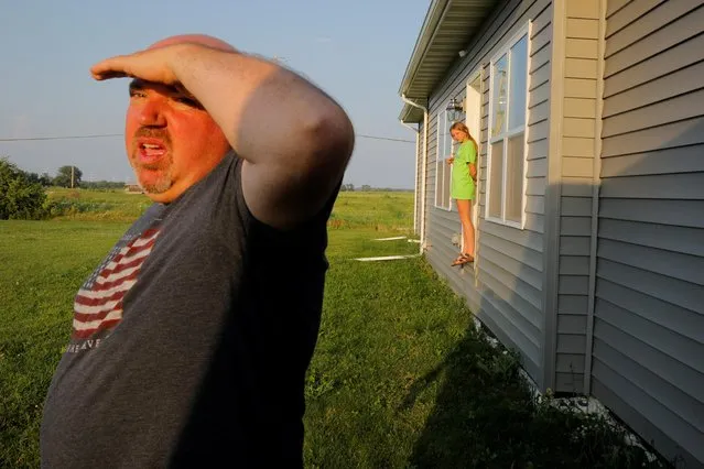 Jim Mahoney looks out from his yard towards the construction of the Foxconn manufacturing complex, after he and his wife Kim refused to sell their home and property to Foxconn, in the Racine County city of Mt. Pleasant, Wisconsin, U.S., July 27, 2019. (Photo by Brian Snyder/Reuters)