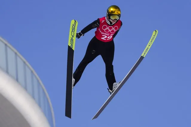 Spela Rogelj, of Slovenia, soars through the air during a women's normal hill ski jumping training session at the 2022 Winter Olympics, Friday, February 4, 2022, in Zhangjiakou, China. (Photo by Andrew Medichini/AP Photo)