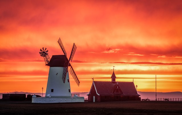 Sunrise over the windmill in Lytham St Annes, a seaside town in Lancashire in the last decade of February 2024. The mill is open to the public during the summer season and entry is free of charge. (Photo by Gregg Wolstenholme/Bav Media)