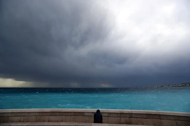 A man looks at an  approaching storm on March 6, 2017, in Nice, southeastern France. (Photo by Valery Hache/AFP Photo)