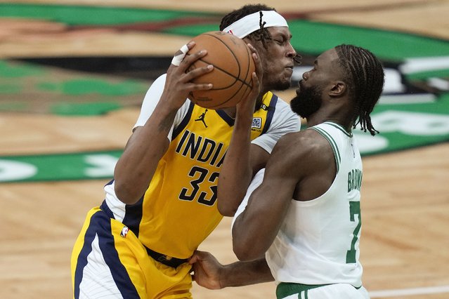 Indiana Pacers center Myles Turner (33) drives against Boston Celtics guard Jaylen Brown (7) during the third quarter of Game 1 of the NBA Eastern Conference basketball finals, Tuesday, May 21, 2024, in Boston. (Photo by Charles Krupa/AP Photo)
