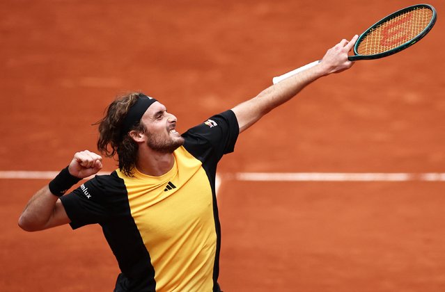 Greece's Stefanos Tsitsipas celebrates after winning against Italy's Matteo Arnaldi at the end of their their men's singles round of sixteen match on Court Suzanne-Lenglen on day eight of the French Open tennis tournament at the Roland Garros Complex in Paris on June 2, 2024. (Photo by Anne-Christine Poujoulat/AFP Photo)