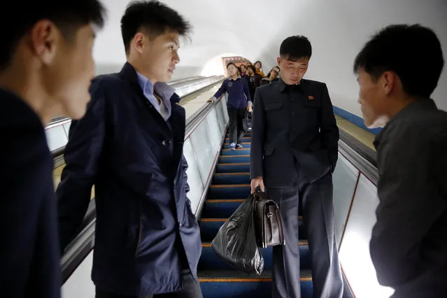 Passengers travel on escalators toward trains at a subway in central Pyongyang, North Korea May 7, 2016. (Photo by Damir Sagolj/Reuters)