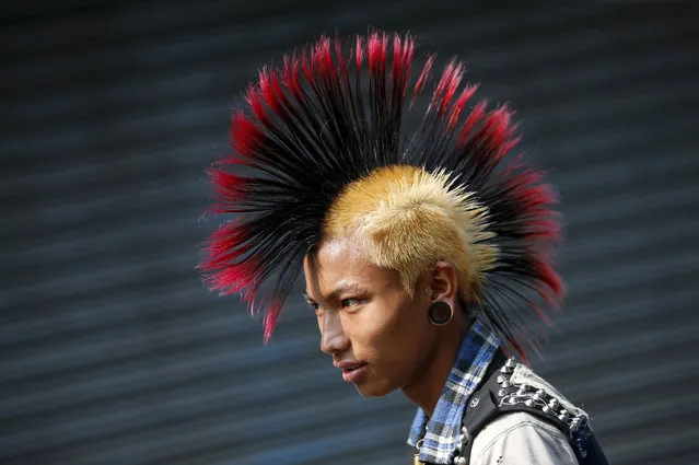 A Myanmar punk wearing a mohawk hairstyle takes part in a punk gathering ahead of the Thingyan water festival in Yangon, Myanmar, 12 April 2017. (Photo by Lynn Bo Bo/EPA)