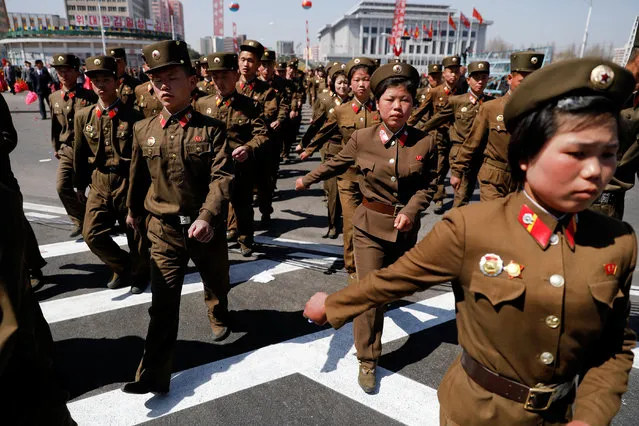 North Korean soldiers march as they visit the newly constructed residential complex after its opening ceremony in Ryomyong street in Pyongyang, North Korea April 13, 2017. (Photo by Damir Sagolj/Reuters)