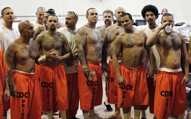 Inmates stand in a gymnasium where they are housed due to overcrowding at the California Institution for Men state prison in Chino, California, June 3, 2011. (Photo by Lucy Nicholson/Reuters)
