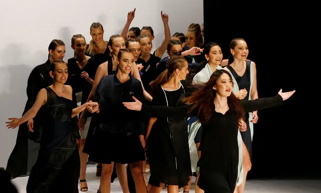 Chinese designer Zhang Yuxin leads models down the runway at the end of her show for the Yuxin collection during Australian Fashion week in Sydney, Australia May 18, 2016. (Photo by Jason Reed/Reuters)