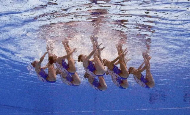 Members of Team Russia are seen underwater as they perform in the synchronised swimming team free routine preliminary at the Aquatics World Championships in Kazan, Russia July 28, 2015. (Photo by Michael Dalder/Reuters)