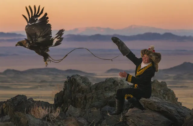 “The eagle huntress”. I wanted to document the “Future Generation” – boys who take their first steps in learning the hunting skills, boys who hold the tradition’s future in their bare hands Ashol Pan is the daughter of an experienced eagle hunter around Han Gohadok, which is south of Ulgii. She was perfect. Photo location: west Mongolia. (Photo and caption by Asher Svidensky/National Geographic Photo Contest)