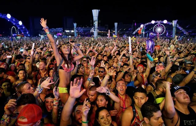 Carnival goers dance to music by Krewella at the Electric Daisy Carnival in Las Vegas on June 21, 2014. (Photo by John Locher/AP Photo)