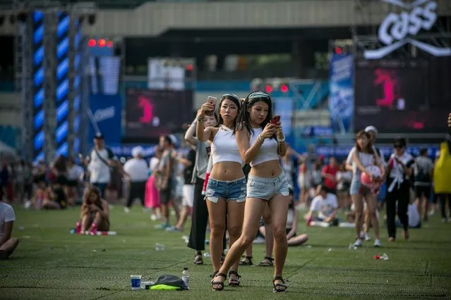 South Korean youths dance to electronic music during the Ultra Music Festival Korea at Olympic Stadium on June 10, 2016 in Seoul, South Korea. (Photo by Jean Chung/Getty Images)