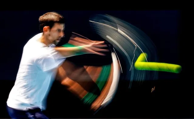 A picture made with a slow shutter speed shows Novak Djokovic of Serbia in action during an Australian Open practice session at Melbourne Park in Melbourne, Australia, 16 January 2020. (Photo by Scott Barbour/EPA/EFE)