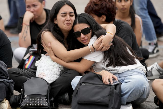 Fans of former One Direction singer Liam Payne gather at the Obelisk to honor him one day after he was found dead at a hotel in Buenos Aires, Argentina, Thursday, October 17, 2024. (Photo by Natacha Pisarenko/AP Photo)