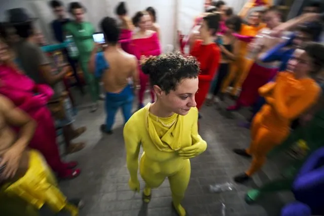 A group of people wearing full solid-coloured bodysuits are seen after taking part in a street art performance in Bat Yam, near Tel Aviv, Israel August 29, 2015. (Photo by Amir Cohen/Reuters)