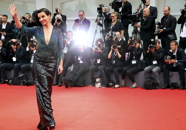 French actress Juliette Binoche waves during the red carpet event for the movie “L'Attesa” (The Wait) at the 72nd Venice Film Festival, northern Italy September 5, 2015. (Photo by Stefano Rellandini/Reuters)