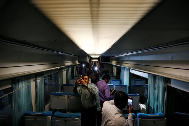 People take pictures inside the high speed Talgo train during its trial run at a railway station in Mumbai, India August 2, 2016. (Photo by Danish Ismail/Reuters)