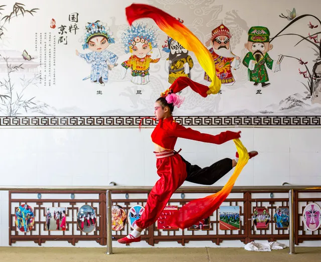 Children practice basic skills of Peking Opera. Hai'an City, Jiangsu Province, China, May 13, 2020. (Photo by Costfoto/Barcroft Media via Getty Images)