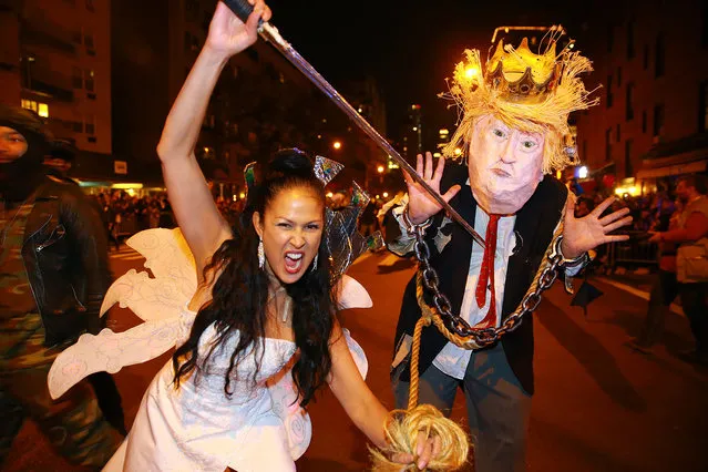 Marni Halasa attacks with a sword a Donald Trump participant at the 44th annual Village Halloween Parade in New York City on Tuesday, October 31, 2017. (Photo by Gordon Donovan/Yahoo News)