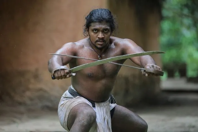 A student of the Sri Lankan ancient martial art “Angampora” performs during a practice session at the angam maduwa or fighting field, in Korathota, a suburb of Colombo, Sri Lanka, 07 September 2022. Sri Lanka's ancient martial art, Angampora, is thought to be thousands of years old. Anga translates to “body parts” and Angampora is a fighting art that uses body parts. Martial arts practitioners in Angampora were mostly in the king's service, and they were tasked with protecting the king and his kingdom. Angampora was practiced in secret for most centuries because the British, who colonized Sri Lanka, banned it in 1818 after seeing it as a threat. (Photo by Chamila Karunarathne/EPA/EFE)