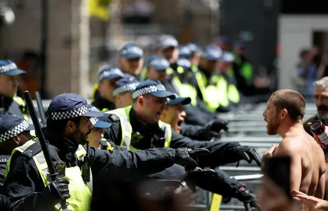 Police officers react ahead of a Black Lives Matter protest following the death of George Floyd in Minneapolis police custody, in London, Britain, June 13, 2020. (Photo by John Sibley/Reuters)