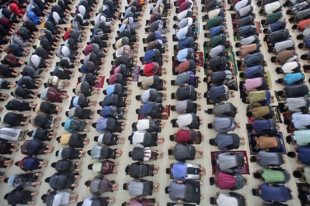Students perform a mid-day prayer during the holy fasting month of Ramadan at Ar-Raudlatul Hasanah Islamic Boarding School in Medan, North Sumatra, Indonesia, Monday, March 3, 2025. (Photo by Binsar Bakkara/AP Photo)