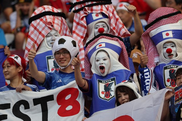 Japan supporters wait for the start of the Qatar 2022 World Cup Group E football match between Germany and Japan at the Khalifa International Stadium in Doha on November 23, 2022. (Photo by Adrian Dennis/AFP Photo)