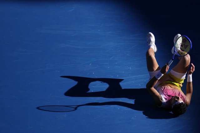 Ben Shelton of the U.S. falls during his quarterfinal match against Lorenzo Sonego of Italy at the Australian Open tennis championship in Melbourne, Australia, Wednesday, January 22, 2025. (Photo by Vincent Thian/AP Photo)